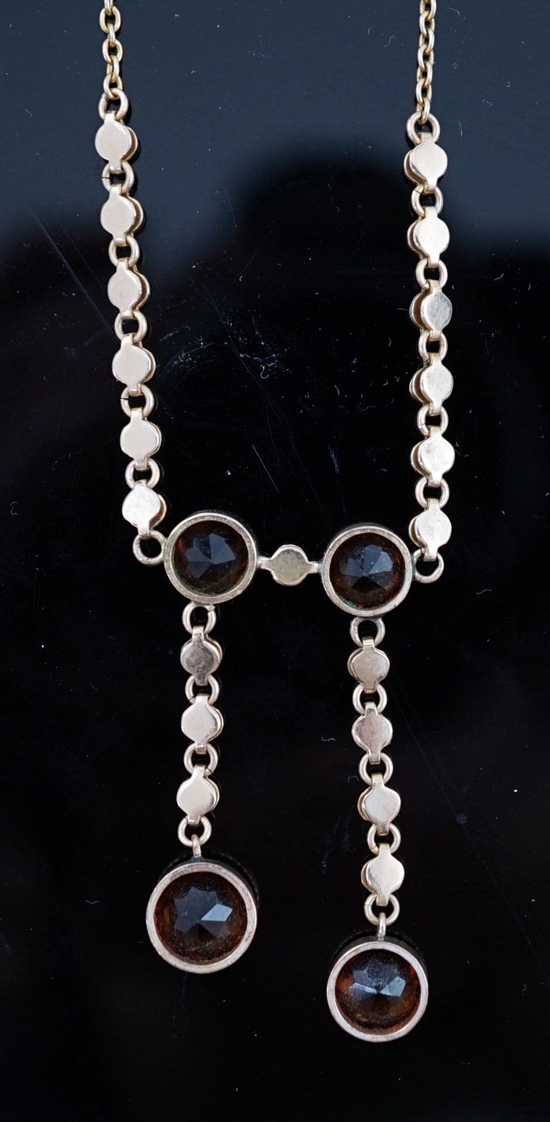 An Edwardian 15ct gold, seed pearl and citrine graduated double drop necklace